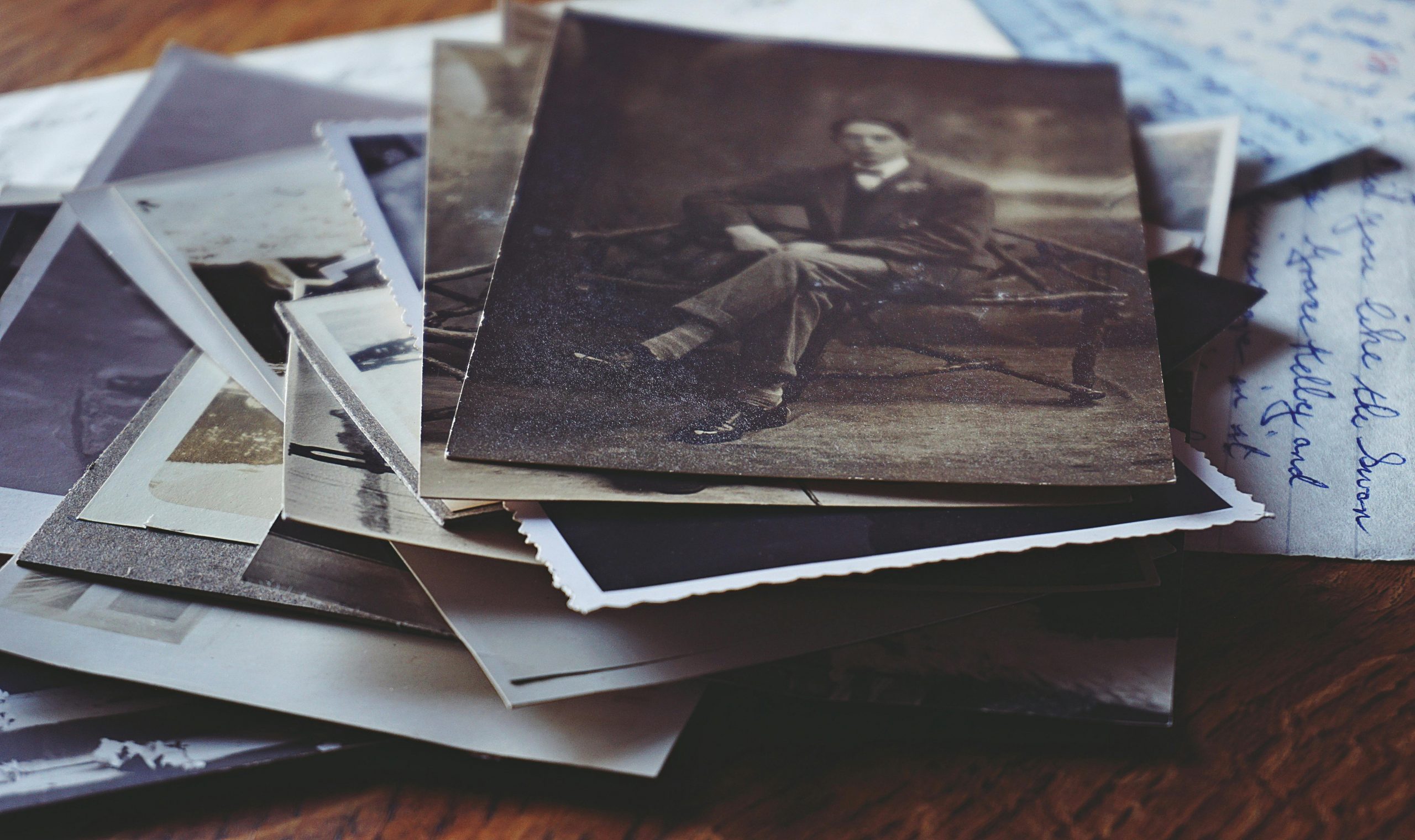 A nostalgic collection of vintage photos and handwritten letters, depicting memories and stories from the past.